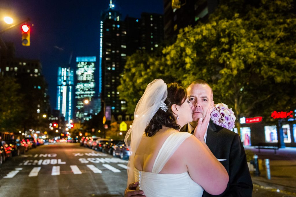 Bride kissing groom in middle of Tribeca crosswalk