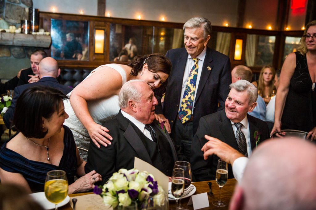 Bride and guests hugging father at a Locanda Verde wedding