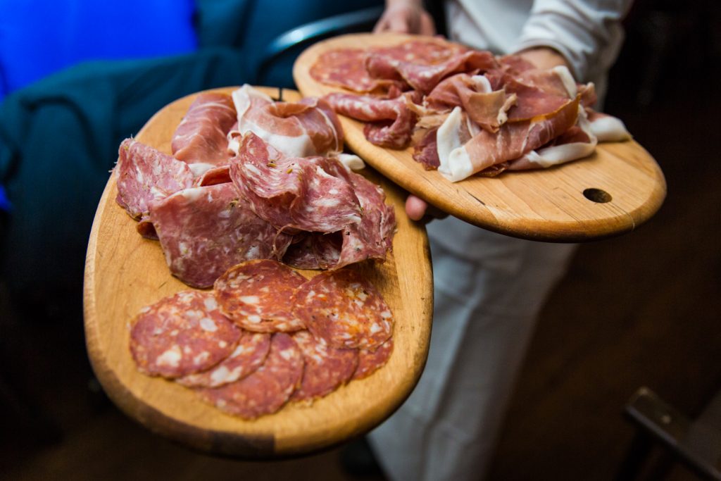 Plates of cured meats at a Locanda Verde wedding
