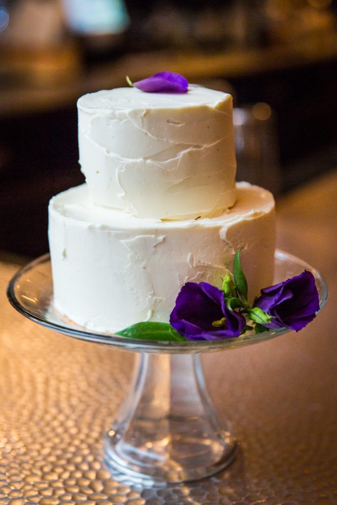 Wedding cake with flowers at a Locanda Verde wedding