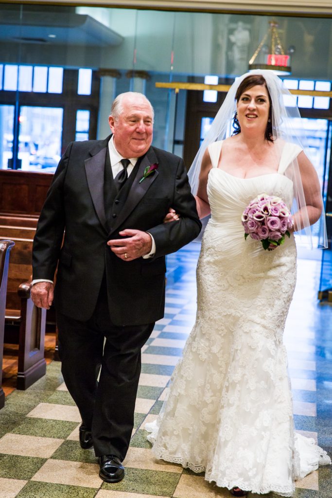 Bride and father walking down aisle at St. Peter's Church wedding