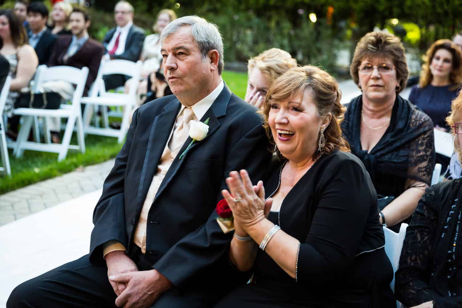 Parents of the bride listening to wedding ceremony