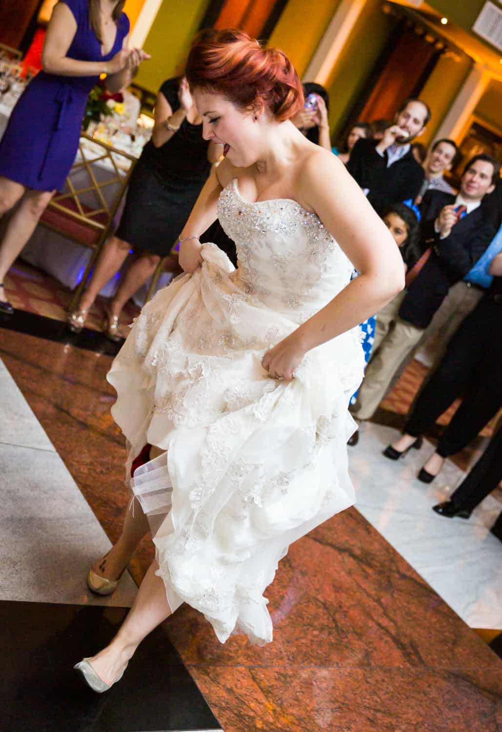 Nicotra's Ballroom wedding photos of bride lifting dress and dancing