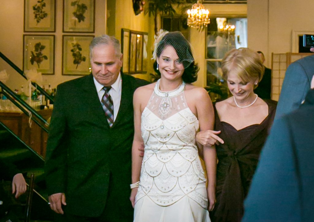 Alger House wedding photos of bride walking down aisle with both parents