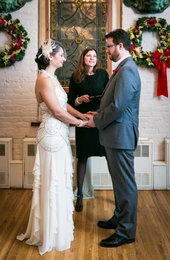 Alger House wedding photos of bride and groom exchanging vows