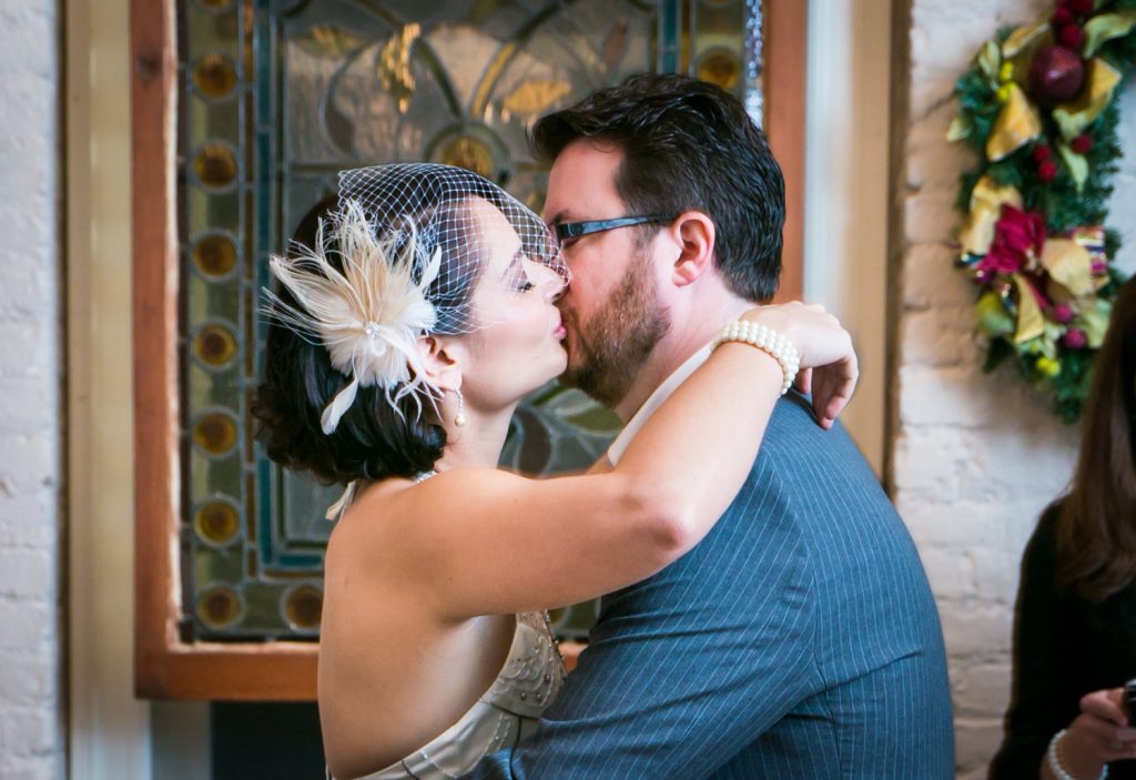 Alger House wedding photos of bride and groom kissing after ceremony