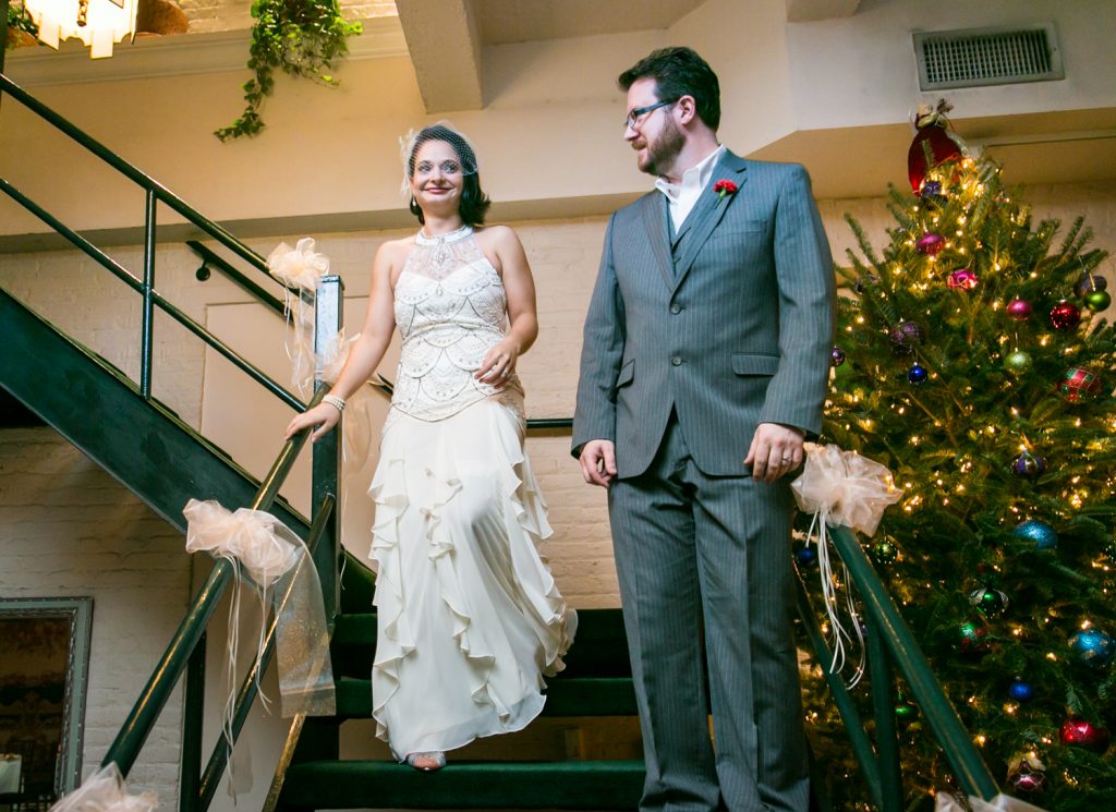 Alger House wedding photos of bride and groom walking down stairs
