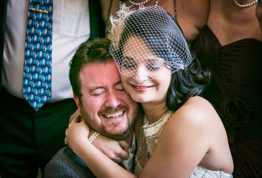 Bride and groom hugging during portrait