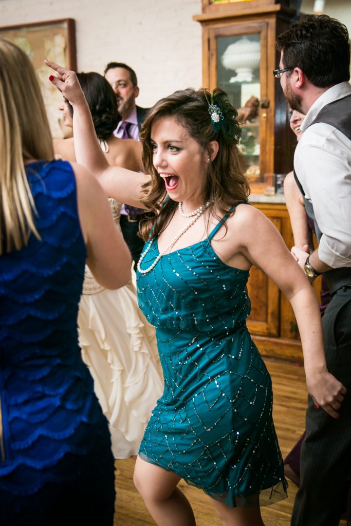 Wedding guest wearing 1920s-style dress dancing the Charleston