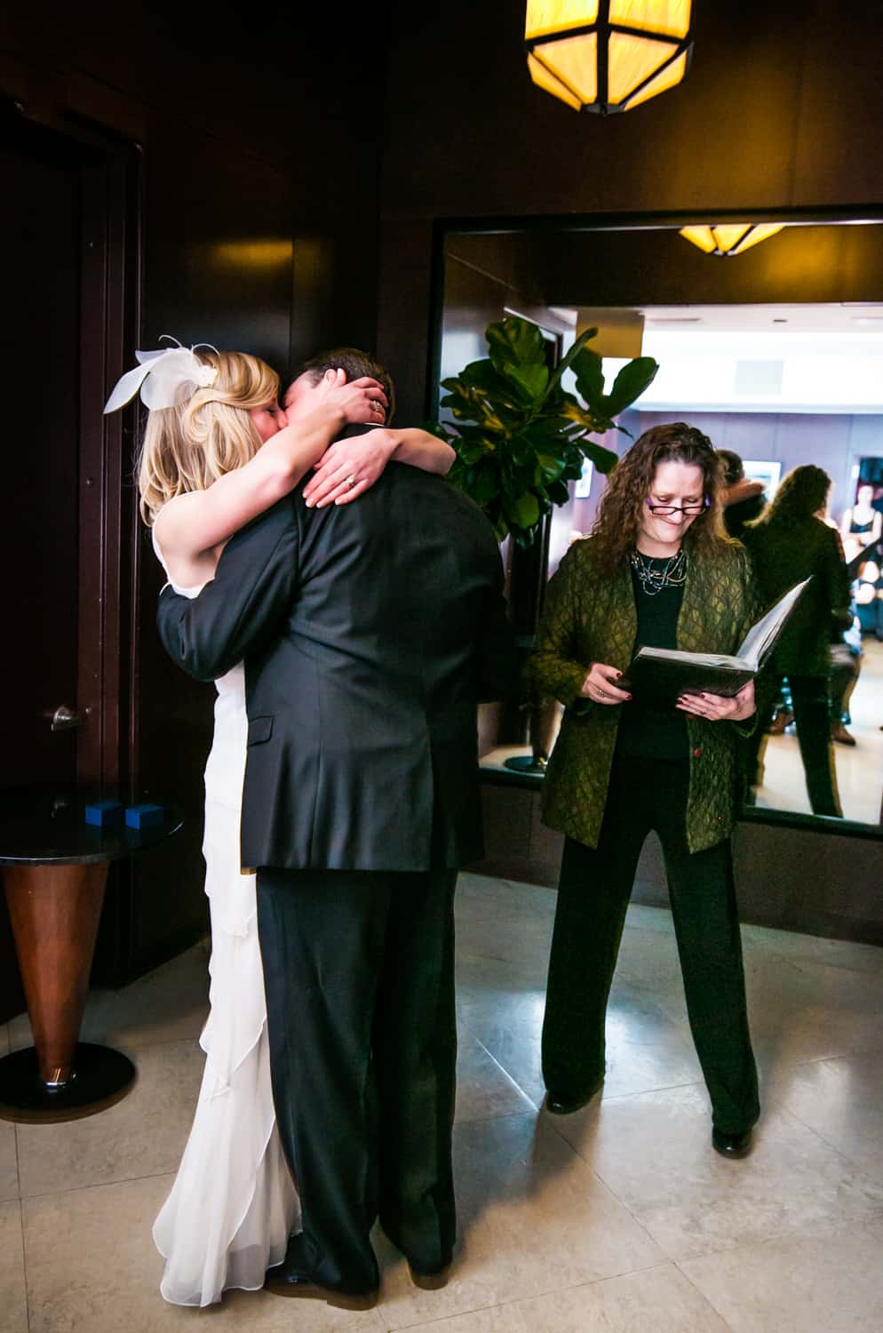 Bride and groom kissing after ceremony at a Library Hotel wedding
