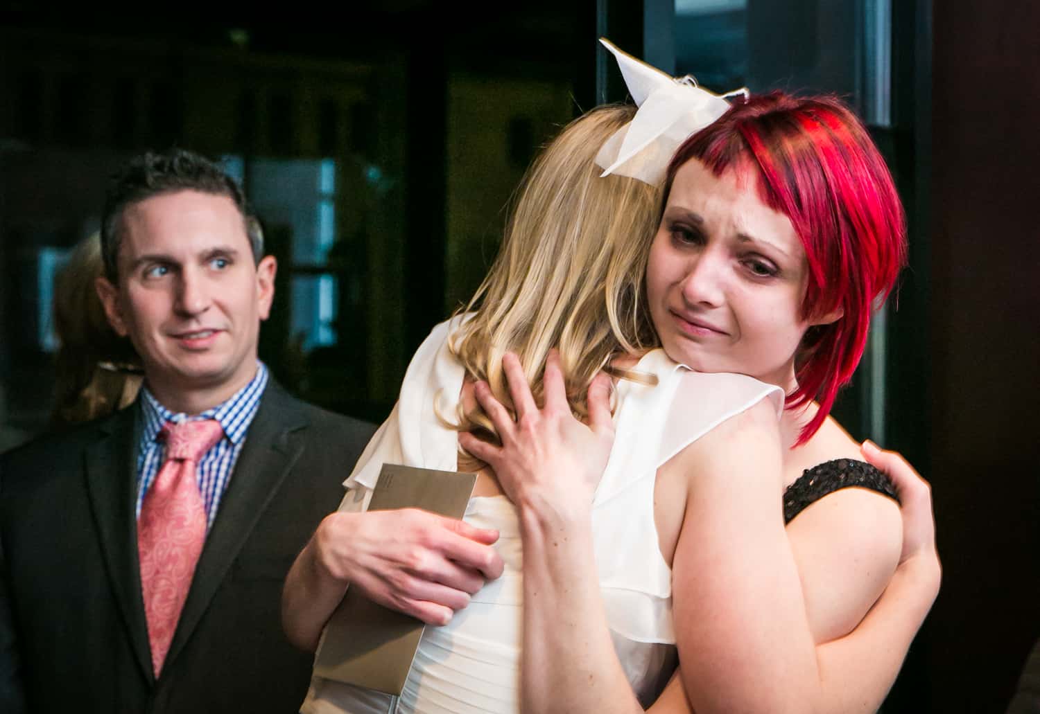 Guest hugging bride at a Library Hotel wedding