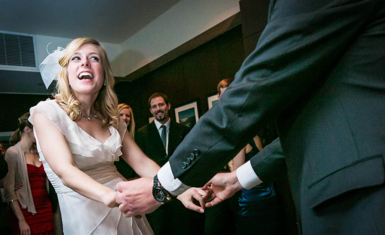 Bride holding hands with father and dancing at a Library Hotel wedding