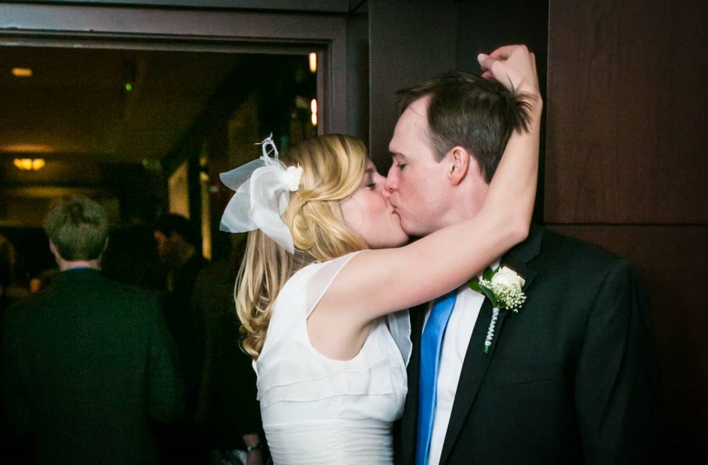 Bride and groom kissing at a Library Hotel wedding