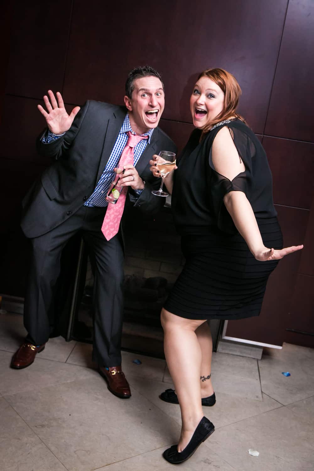 Couple making funny faces and posing at a Library Hotel wedding