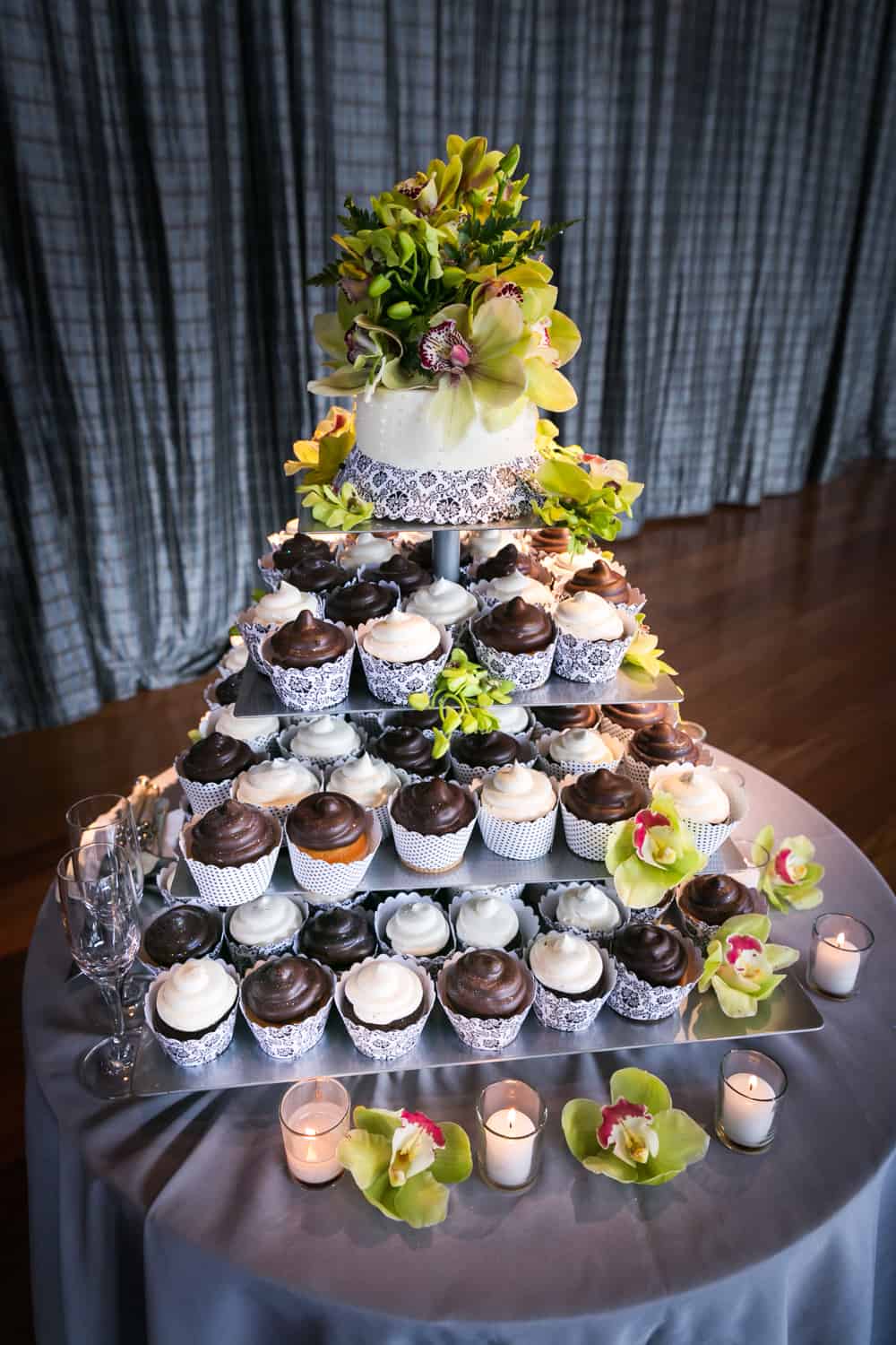Tier of cupcakes with orchids