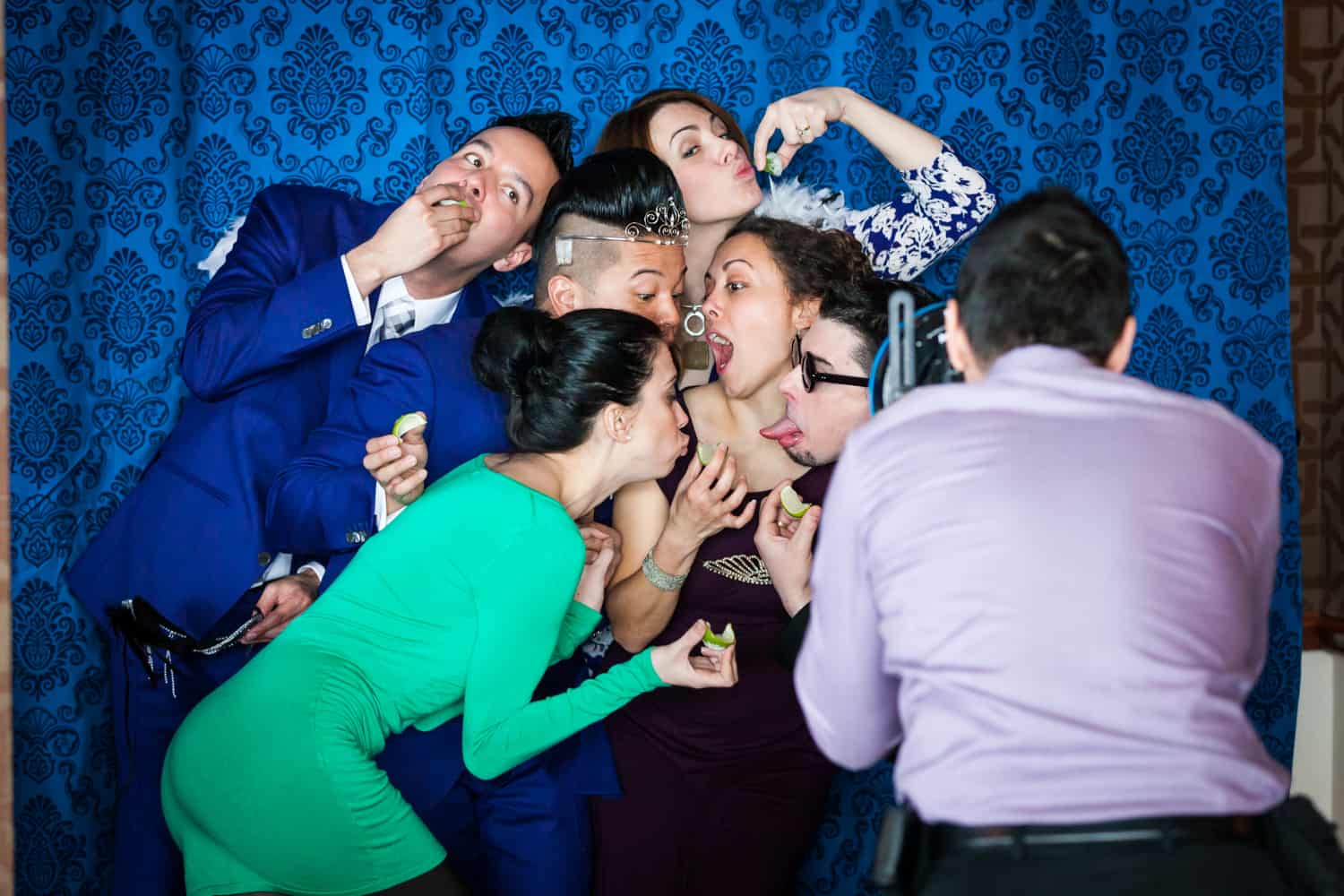 Guests clowning around at photobooth at a Lighthouse at Chelsea Piers wedding