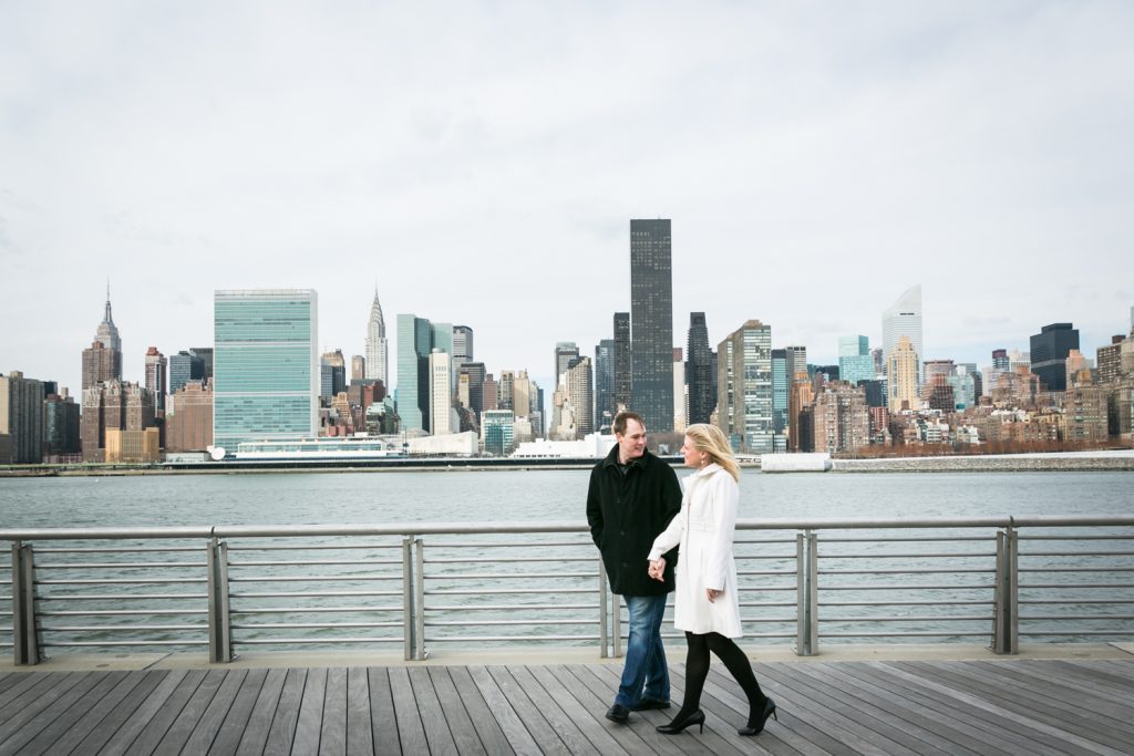 Bride and groom walking in Gantry Plaza State Park at a Long Island City wedding brunch