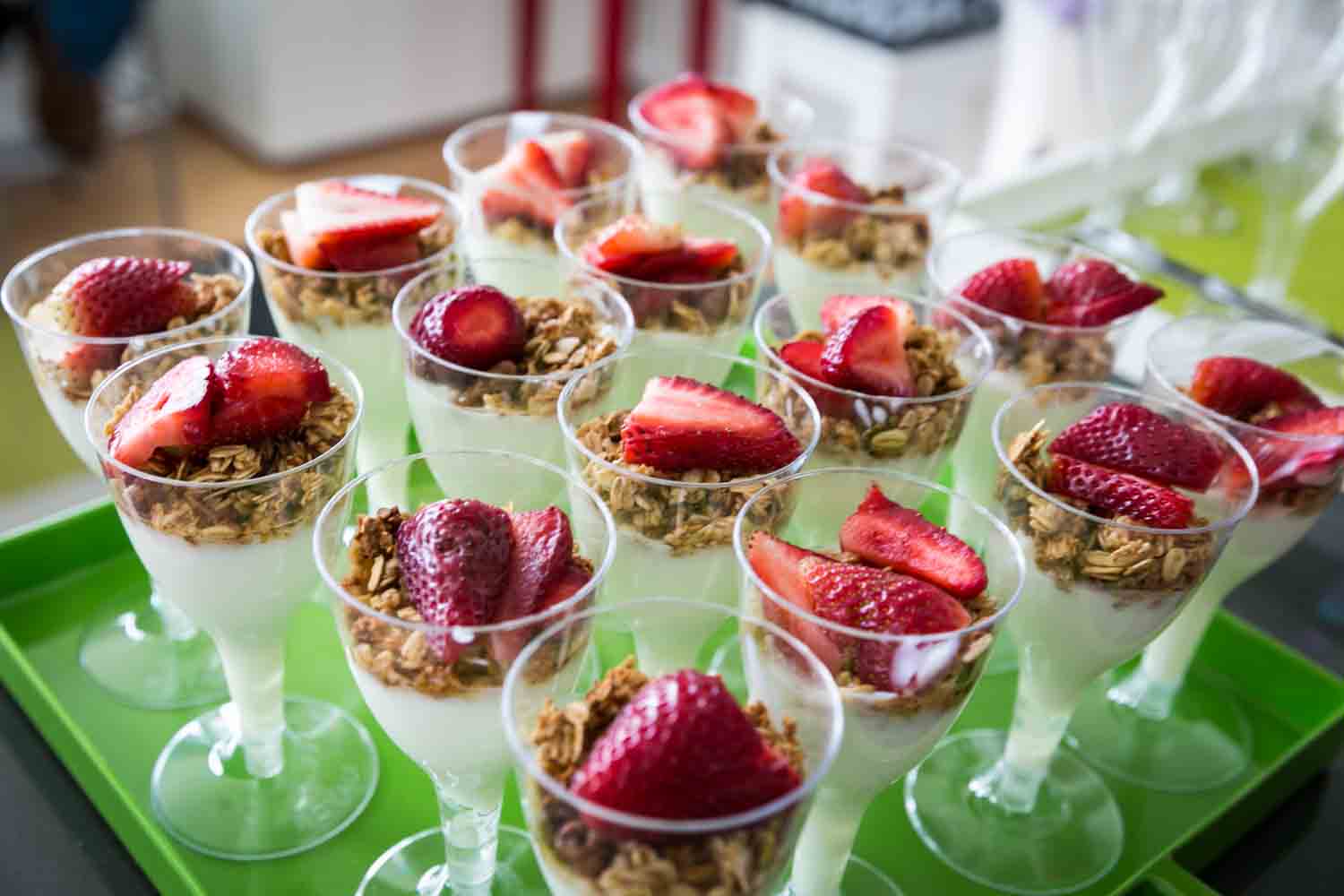 Wine glasses filled with yogurt and strawberries at a Long Island City wedding brunch