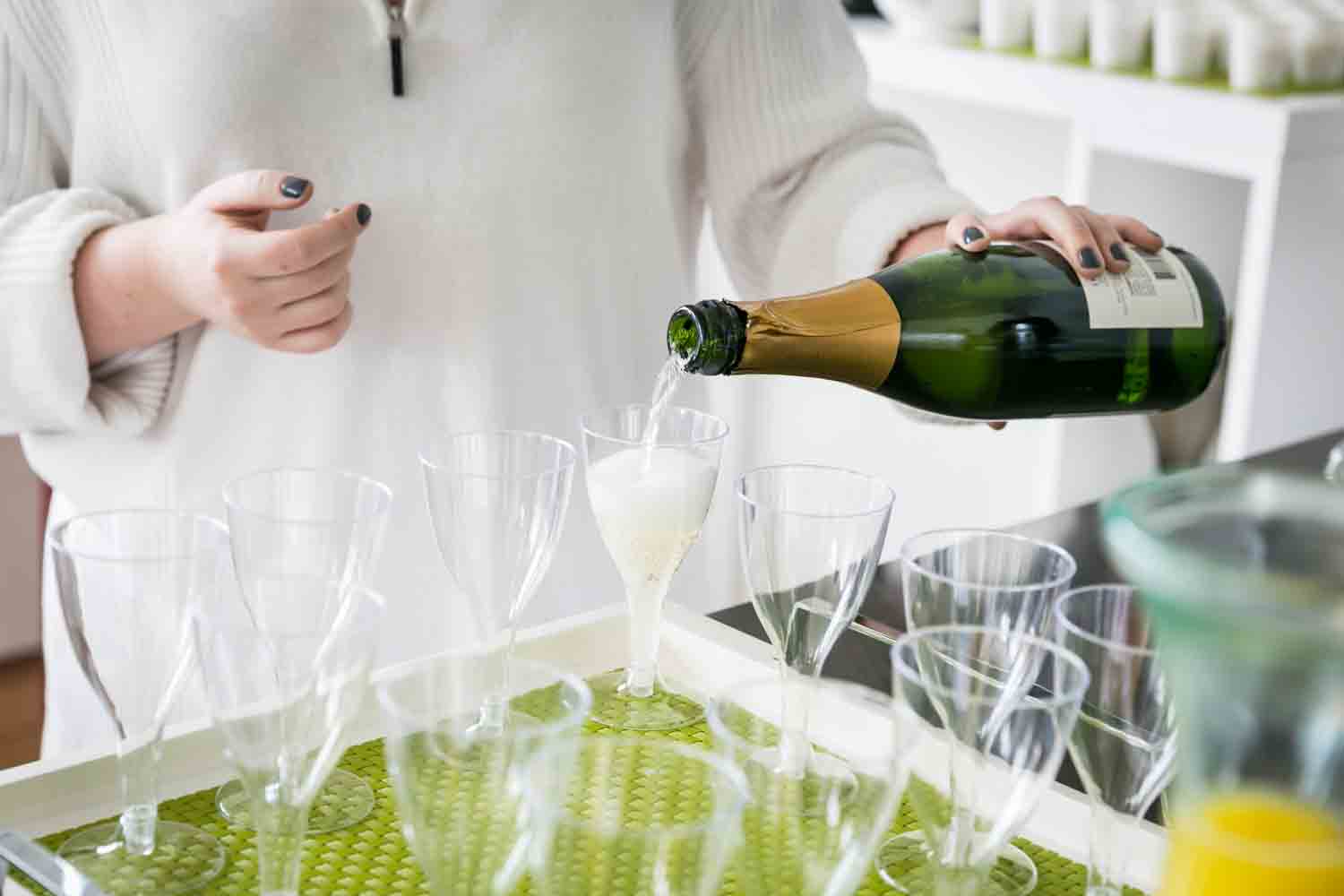 Close up of woman pouring champagne