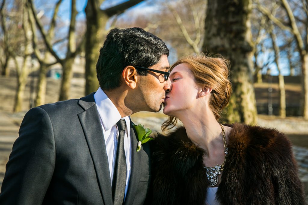 Bride and groom kissing in Fort Greene Park