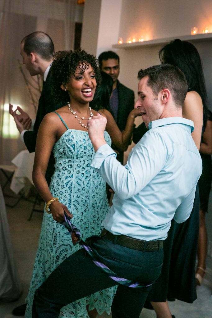 Couple dancing with tie at a Maison May Brownstone wedding