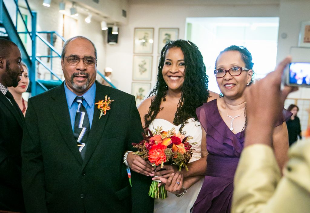 Alger House wedding portraits of bride and both parents walking down aisle