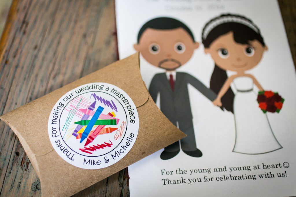 Close up on packet of crayons and wedding activity book