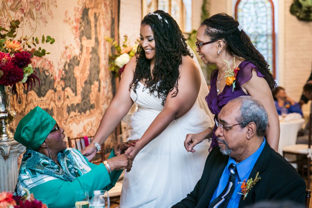 Alger House wedding portraits of bride greeting older woman at table