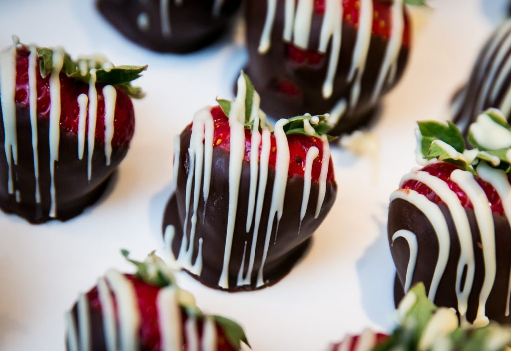 Close up on chocolate covered strawberries with which chocolate icing