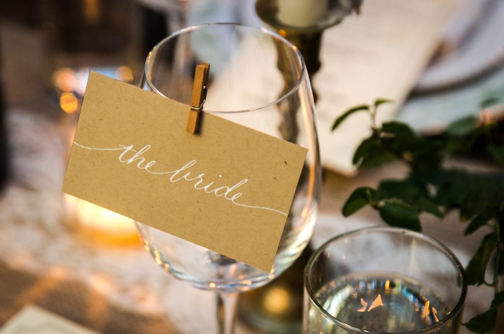 Close up on wine glass with 'the bride' sign at a Brooklyn Winery wedding