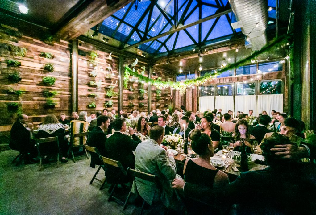 Wide shot of guests seated during reception at a Brooklyn Winery wedding