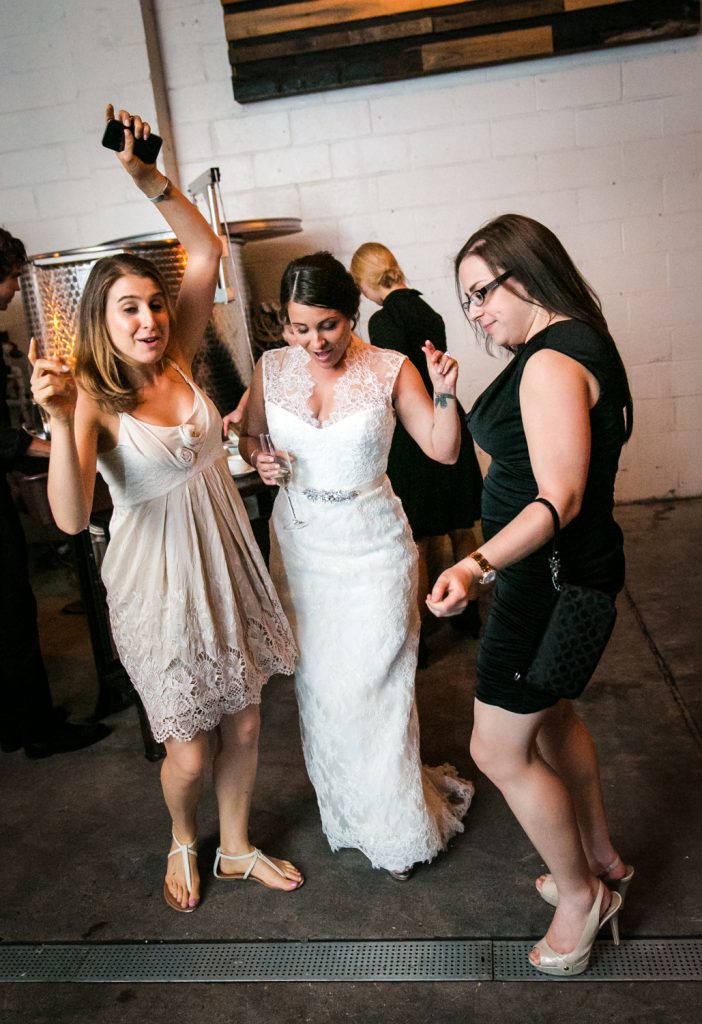 Bride and two female guests dancing at a Brooklyn Winery wedding