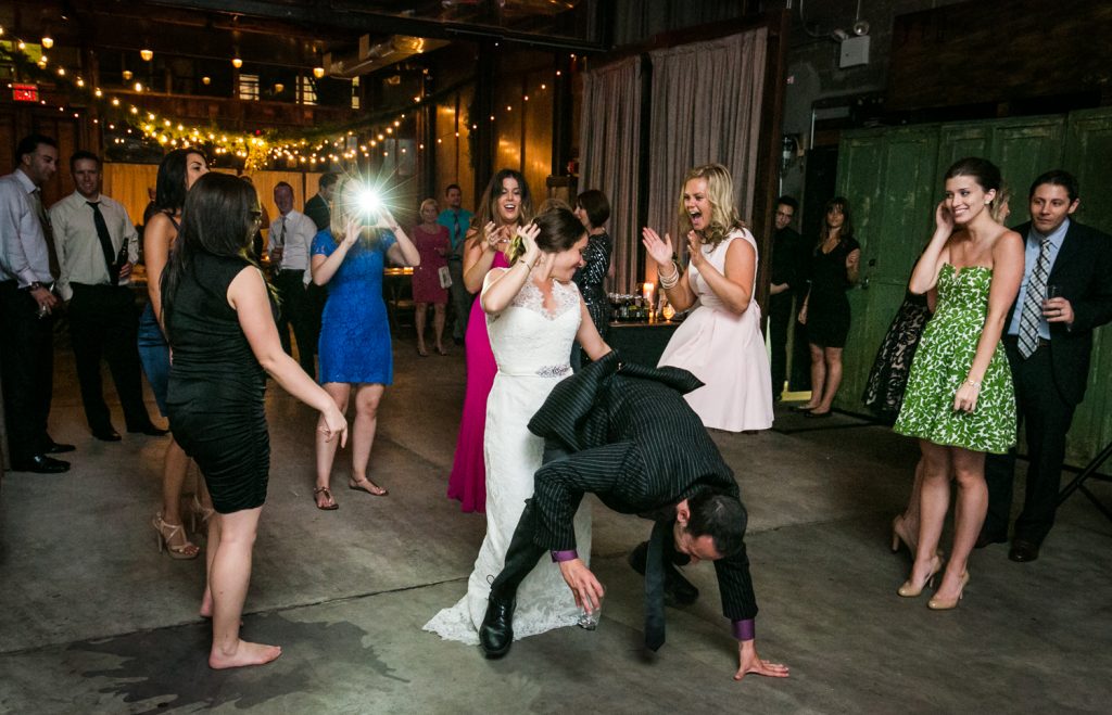 Bride dancing wildly with guests at a Brooklyn Winery wedding