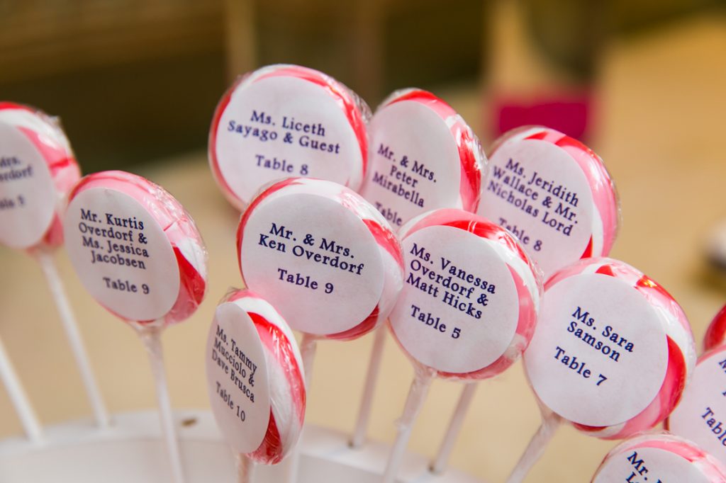 Lollipops with seating assignments at Riviera Waterfront Mansion wedding