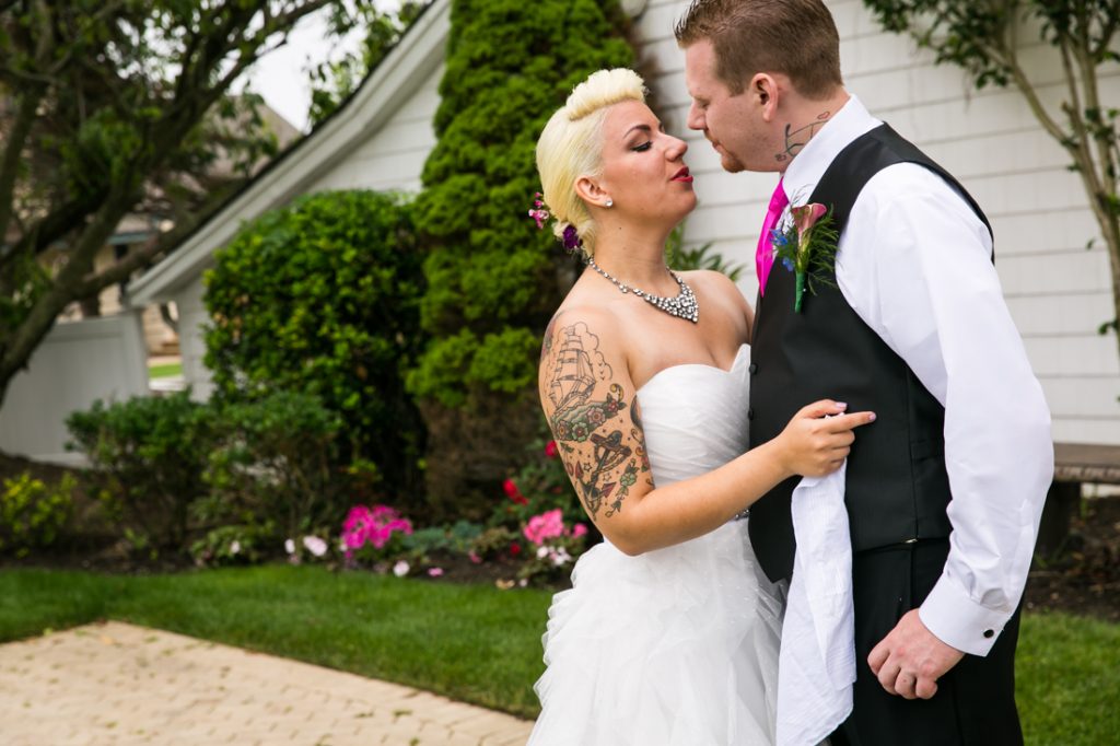 Bride and groom about to kiss before their Riviera Waterfront Mansion wedding