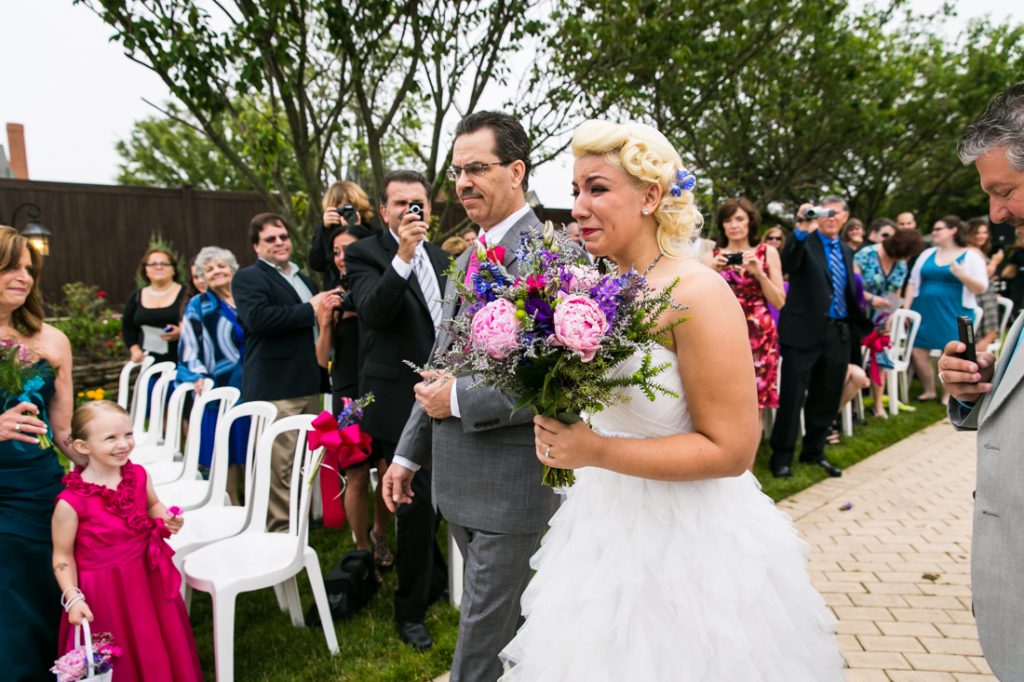 Bride and father walking down aisle at Riviera Waterfront Mansion wedding