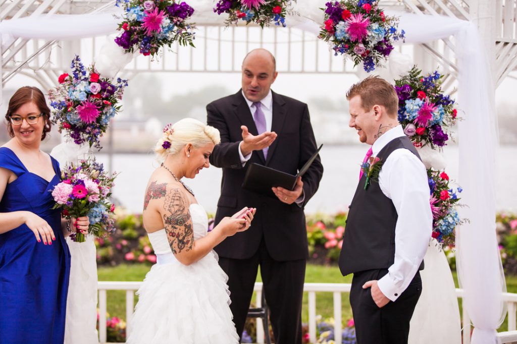 Bride and groom exchanging vows at Riviera Waterfront Mansion wedding