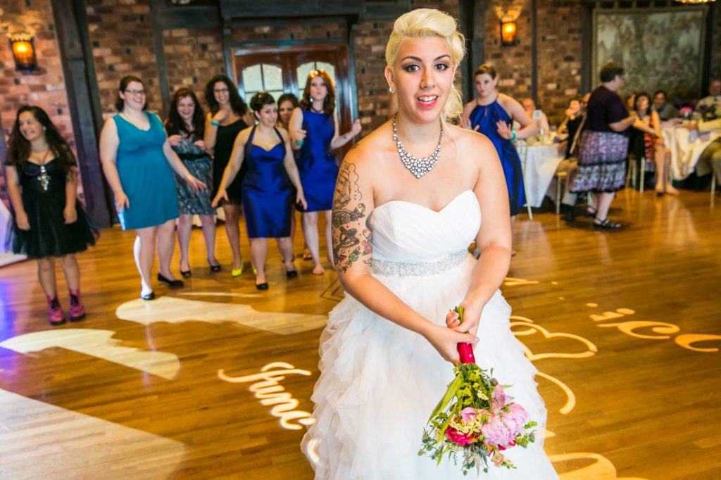 Bride about to throw bouquet at Riviera Waterfront Mansion wedding