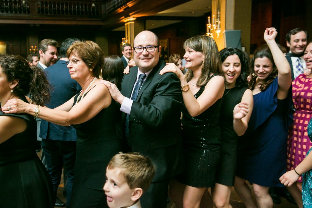Harvard Club wedding photos of guests in a conga dance line