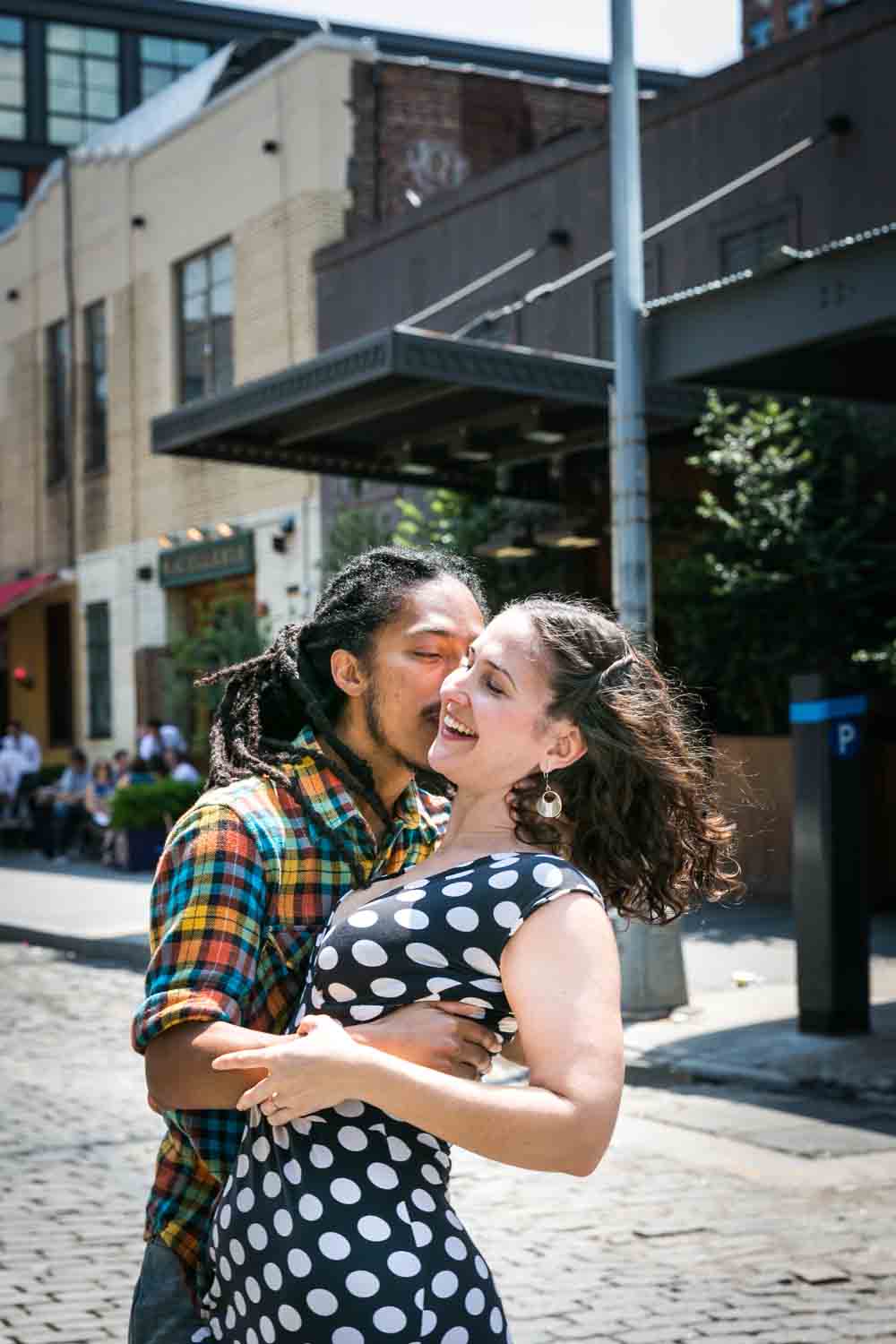 Meatpacking District engagement photos of couple dancing in middle of street