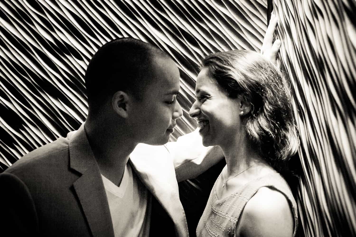 Black and white photo of couple in elevator during a Hudson Hotel engagement shoot