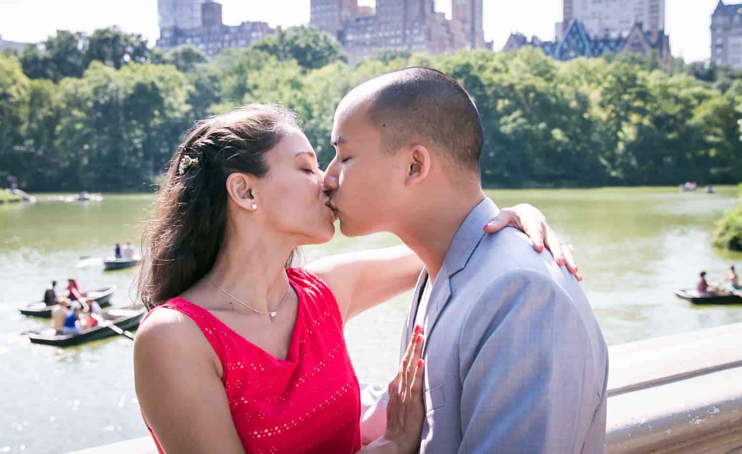 Couple kissing on Bow Bridge
