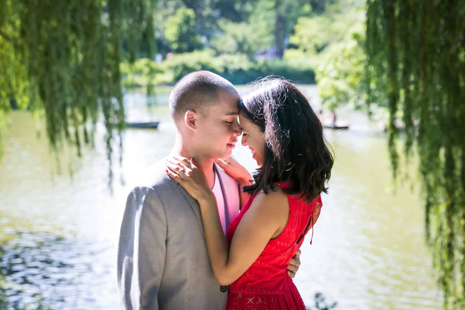 Couple hugging beside Central Park lake