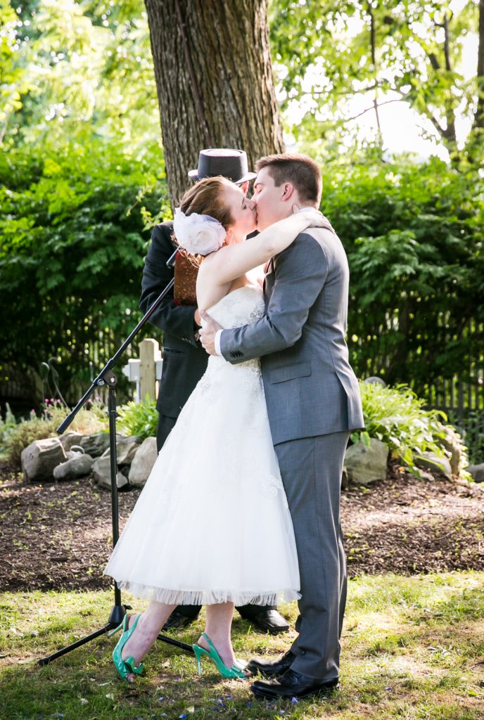 Bride and groom kissing after ceremony at a Round Hill House wedding