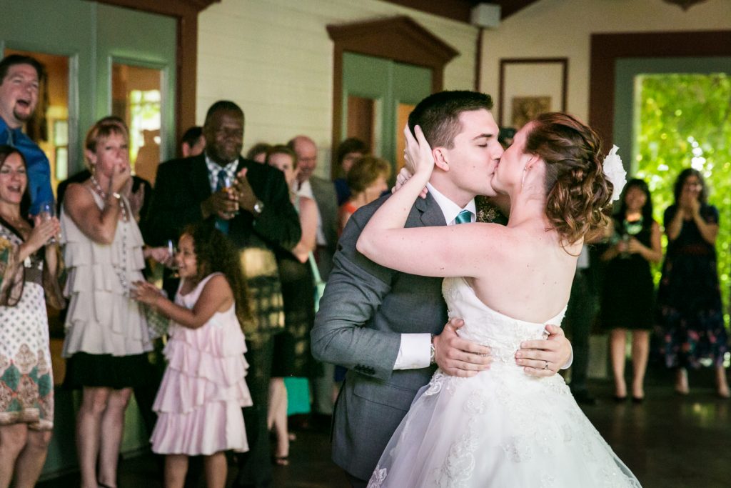 Bride and groom kissing on dance floor at a Round Hill House wedding
