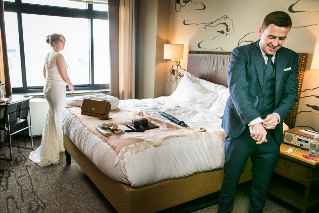 Bride and groom getting ready in hotel room