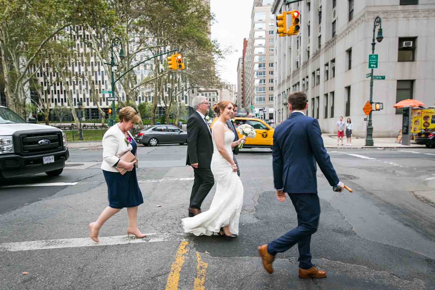 Bridal party walking across NYC street