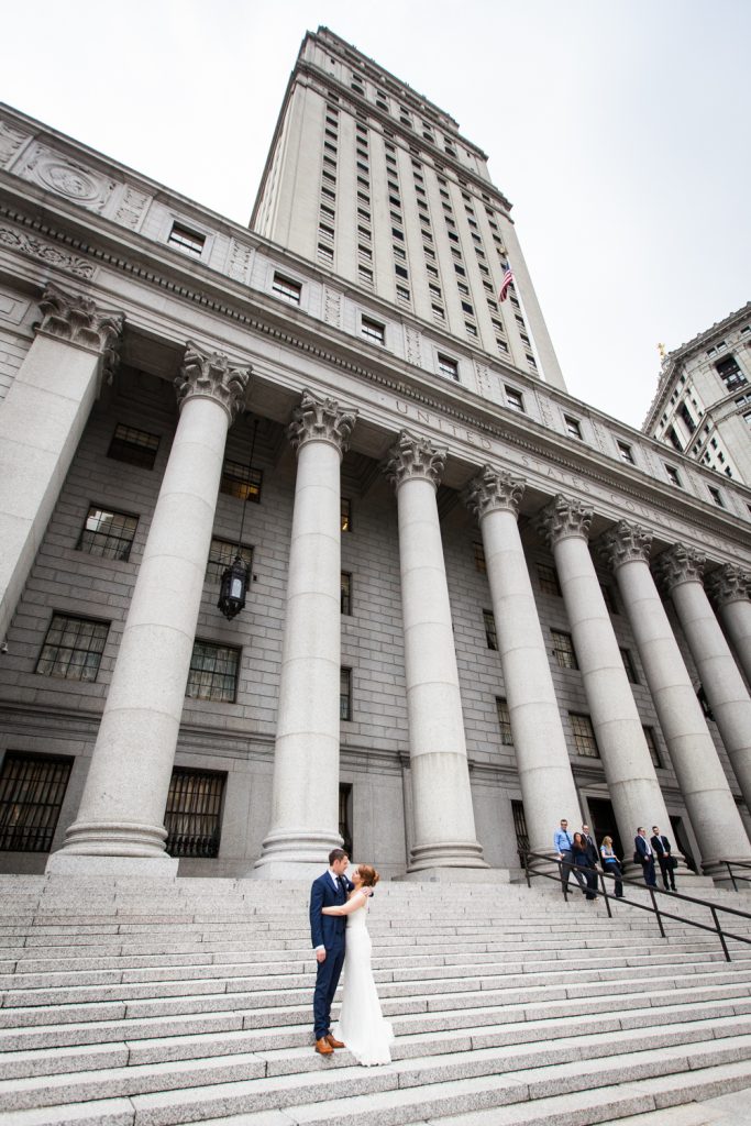 Bride and groom on steps of New York County Supreme Court building