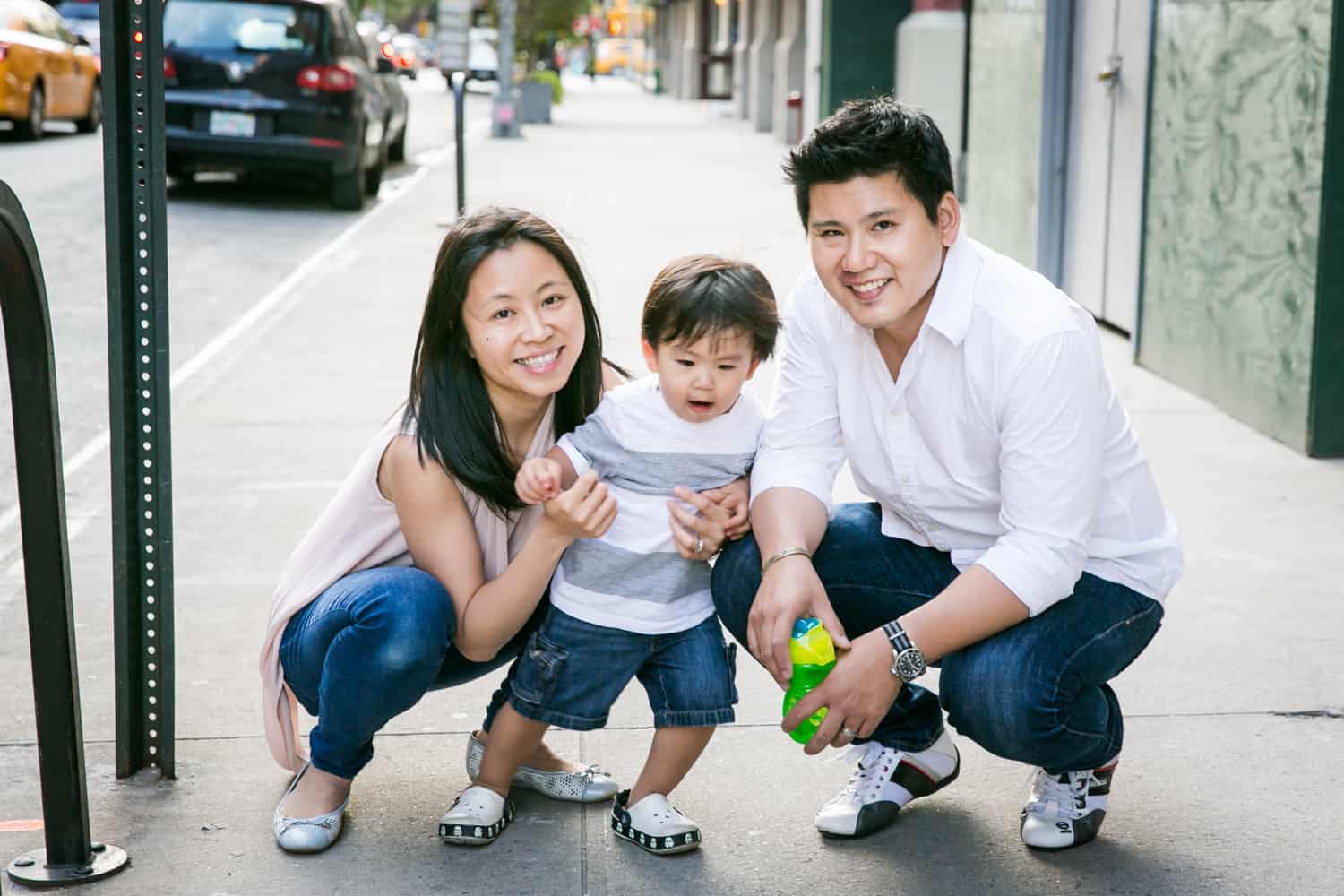 Portrait of Asian American family in the middle of sidewalk