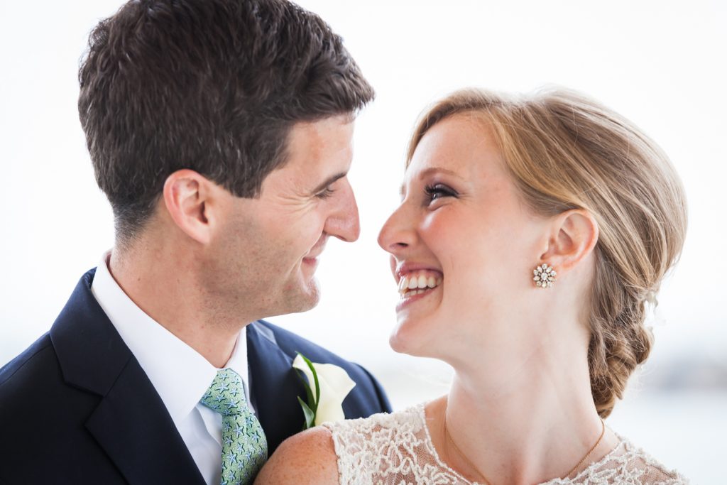 Bride and groom smiling at each other at an American Yacht Club wedding